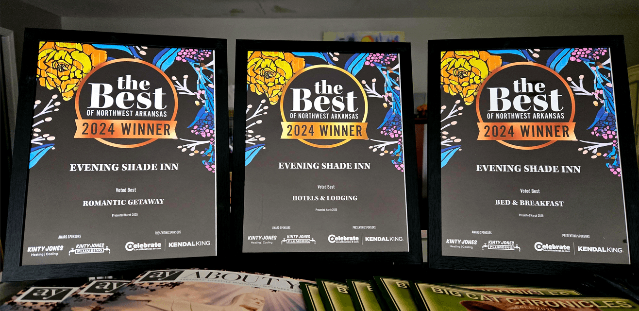 Three award plaques for "Evening Shade Inn" recognizing it as the 2024 winner in categories: Romantic Getaway, Hotels & Lodging, and Bed & Breakfast.