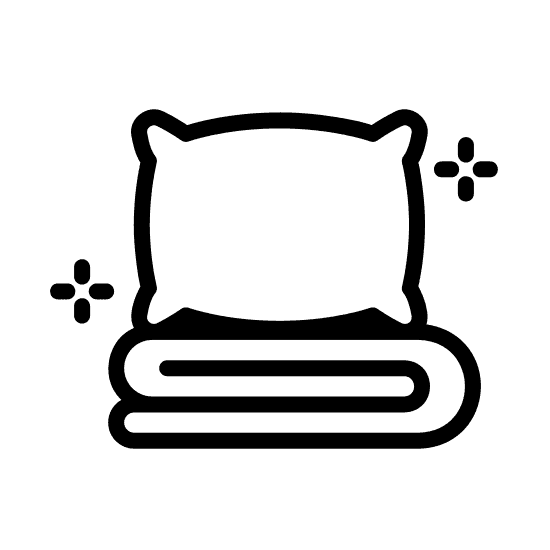 A simple black silhouette of a pillow stacked on top of folded sheets.